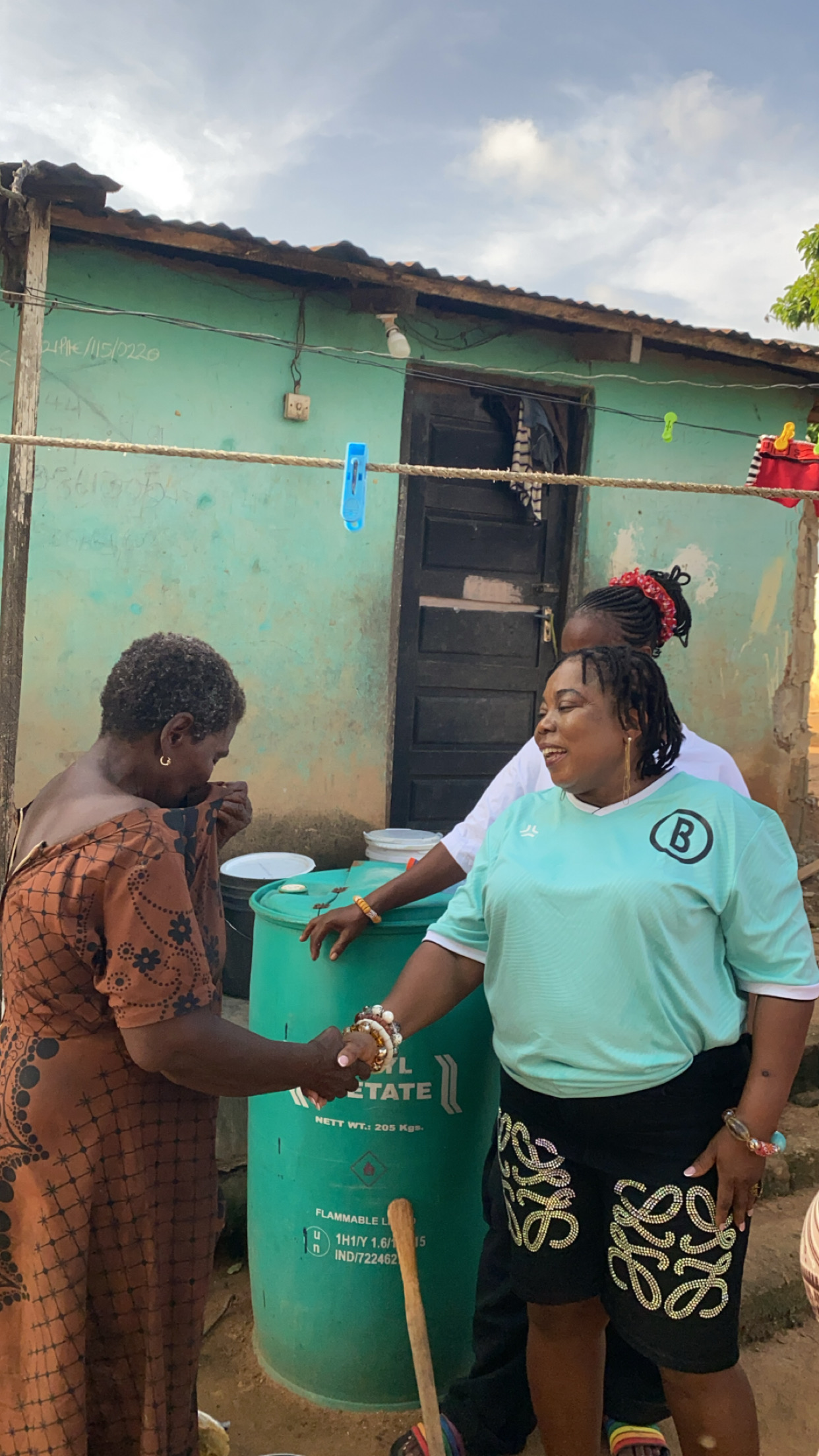 Founder greeting beneficiary